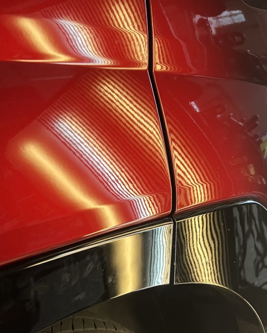 After: the light board's stripes run evenly across the red rear quarter